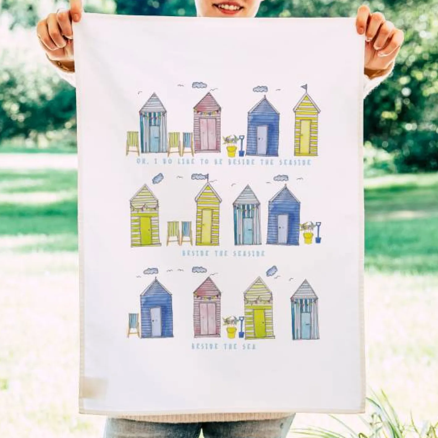 This Is Nessie Beach Huts Tea Towel by