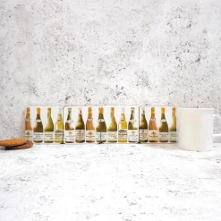 Corinne Alexander White Burgundy Coaster Set by